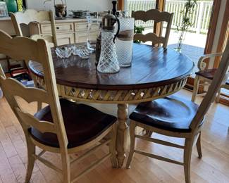 Round dining table with 1 leaf and 6 chairs