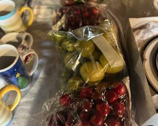 Fake plastic fruit cherries, apples and artichokes 