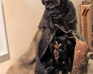 Beautifully carved African elder with dress.