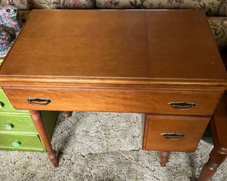 Singer sewing machine with maple cabinet