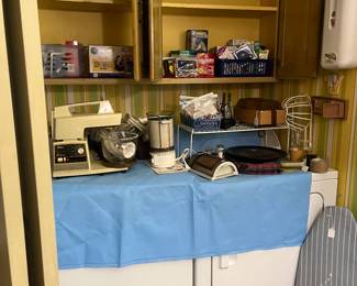 Many household items and light bulbs, ironing board and iron, plus a travel iron