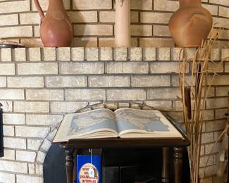 Large coffee table books and a display shelf