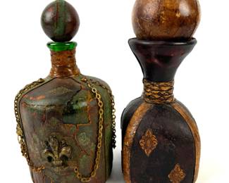 #89 • 2 Vintage Leather Covered Glass Decanters with Stoppers
WWW.LUX.BID