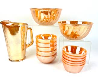 #178 • 1950's Fire King Peach Luster Swirl Pattern Bowls And Pitcher Set- 14 Pieces
WWW.LUX.BID