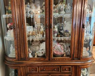 Traditional China Cabinet filled with all types of collectibles. 