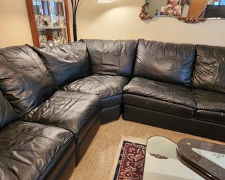 Attractive Black Naughahyde Sectional Sofa