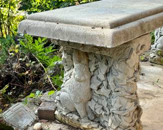 Large Concrete Bench with Rabbits sculpted into each side of the base.