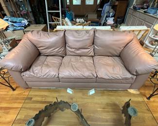 Leather Couch and Custom Made Glass Top Coffee Table with brass & copper art base believed to be made by Curtis Jere.