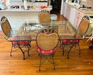 Beautiful Glass Top Dining Table and Chairs - Iron legs and embellishments with Wicker Chair-backs