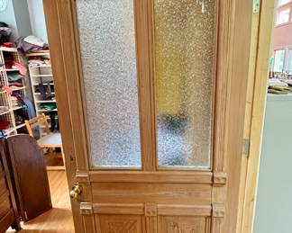 One of three custom doors that are for sale in this house.