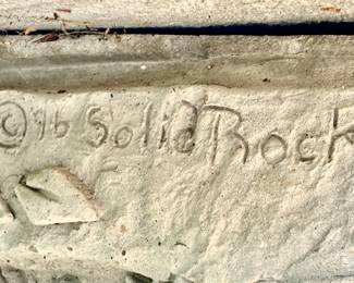 Large Concrete Bench with Rabbits sculpted into each side of the base.