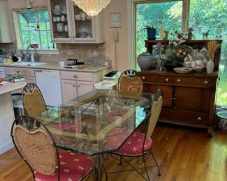 Beautiful Glass Top Dining Table and Chairs - Iron legs and embellishments with Wicker Chair-backs