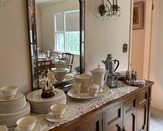 Decorative mirror  above sideboard.  
