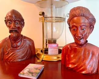 Antique carved busts, ivory or bone teeth and eyes.