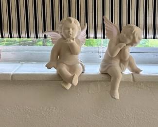 The pair of white angels are sold.