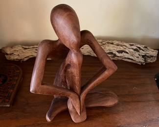 WOODEN ABSTRACT STATUE IN PRAYER
