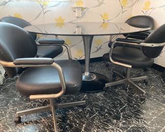 Vintage Chromcraft tulip table with smoky glass. Four vintage Chromcraft chairs. All in excellent condition