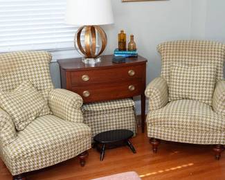 Comfy chairs flank a Tomlinson Furniture bow front table