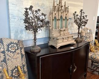 Side board, Antique miniature altar, candelabras, gold light sconces, upholstered dining chairs (part of a set) and large abstract painting. 