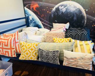 Lots if great accent pillows and metal framed bed 