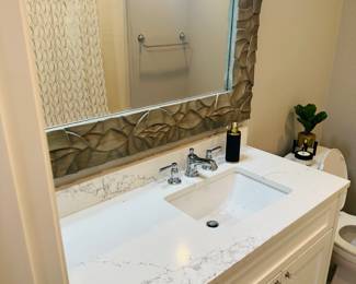Mirror, counter top and vanity, sink and faucet. Toilet also available as is the bathtub and fixtures. 