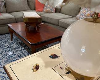 Sectional, area rug, butterfly table, white globe lamp