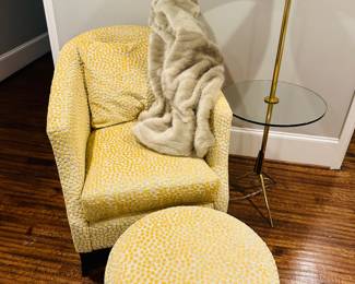 Pretty yellow accent chair with ottoman and side table lamp. 