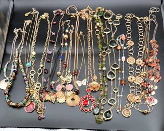 Collection Of Golden Costume Jewlery With A Pop Of Color