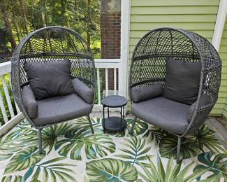 Two gray egg chairs 