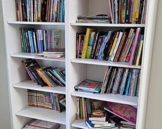 Two tall white book shelves 