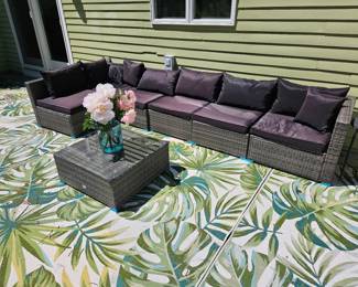 Outdoor sectional with black cushions 