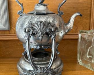 antique teapot on stand with burner. 