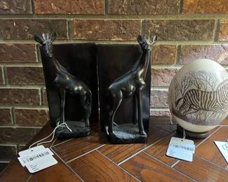 Giraffe carved bookend pair, zebra painted ostrich egg