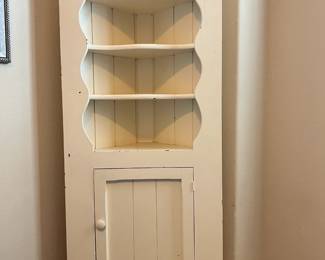 Corner Cabinet measuring 26" wide, 14" deep, and 65.5" tall $75.00