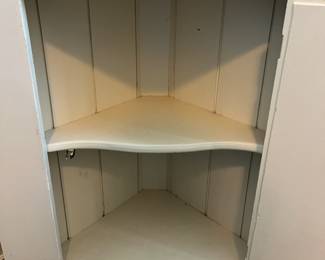 Corner Cabinet measuring 26" wide, 14" deep, and 65.5" tall $75.00