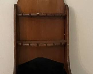 Vintage wooden wall mounted souvenir spoon collection display.