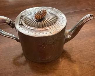 Antique English engraved pewter teapot.