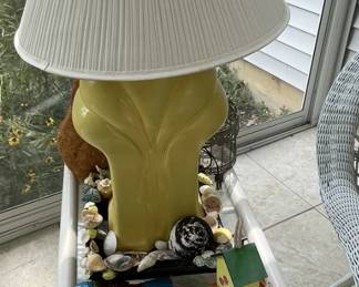 Bamboo side table and yellow lamp.