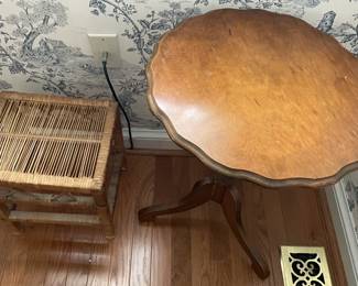 Pie crust table and small woven stool.