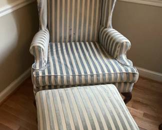 Blue and white striped armchair with matching ottoman.