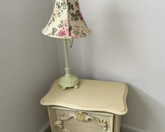End table with floral lamp.