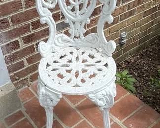 Victorian style cast iron fancy garden chairs.