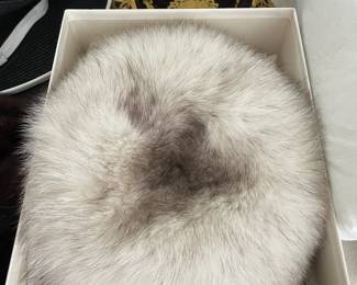 Fur hat in box.