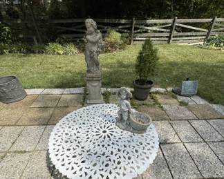Garden ornaments and vintage cast iron dining table.