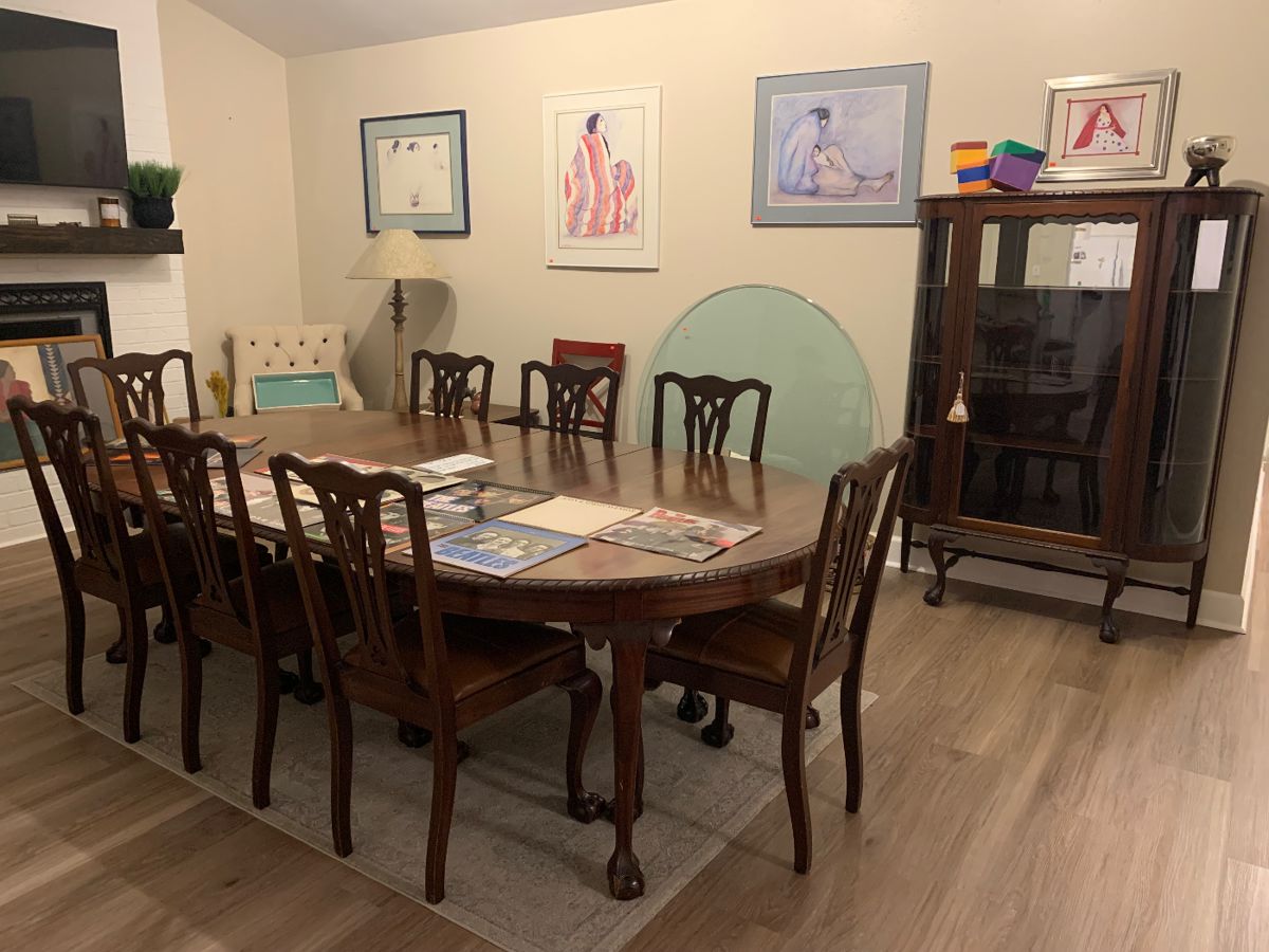 Antique Lifetime Furniture solid wood ball and claw feet Dining Table with eight leather upholstered chairs and five leaves. Matching curio cabinet. Mid-century modern side table. 1/2 inch thick round glass table top. Enfield sword and various antique pieces.