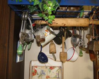 Another picture of the vintage and antique kitchen utensils, and pot rack