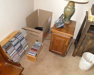 CD's end table and lamp, along with a stray garbage can