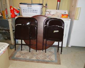 Folding table and chairs, otherwise known as a card table and chairs