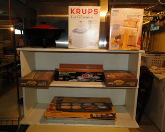 Wooden shelving with ice cream maker, pasta maker, and electric skillet