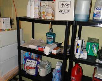 More metal shelving, with laundry, and cleaning, and personal care supplies too
